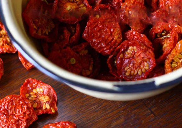 "What to do with cherry tomatoes," I found myself muttering last summer. So I got out the dehydrator and turned a bumper crop of sweet, red fruit into the tastiest dried tomato snackin' bites. Y