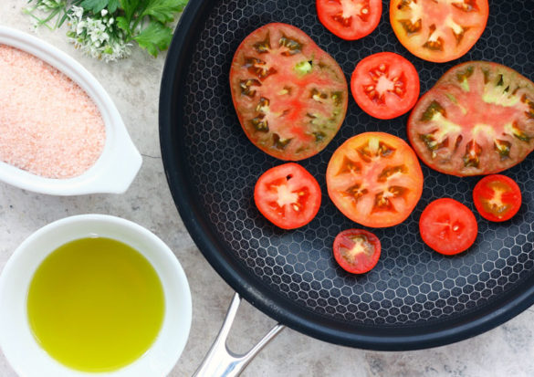 Perfect fried breakfast tomatoes start with firm ripe tomatoes and are finished off with a drizzle of olive oil, minced rosemary and salt.